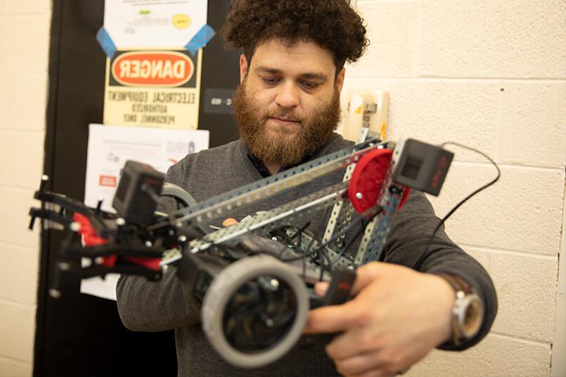 male student working on mechanical project